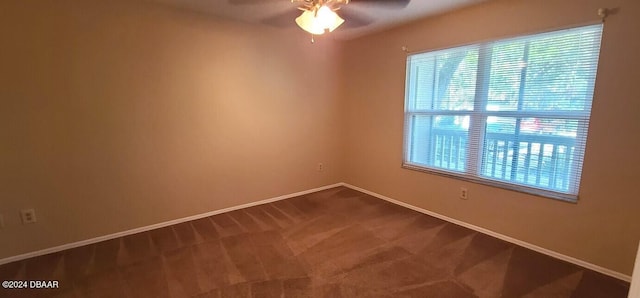 empty room featuring ceiling fan and carpet floors