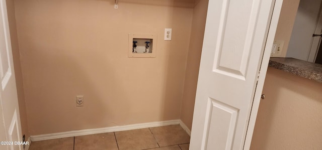 clothes washing area with hookup for an electric dryer, light tile patterned floors, and washer hookup