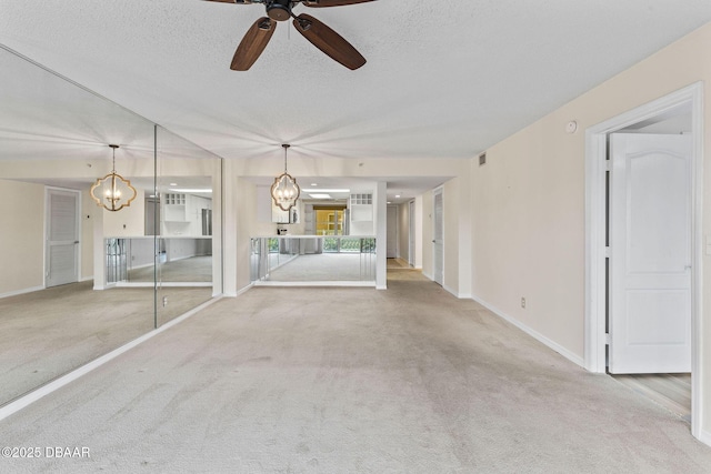 4 Oceans W Blvd Unit 306B, Daytona Beach, FL 32118 - unfurnished living room featuring a chandelier, carpet, a ceiling fan, a textured ceiling, and baseboards