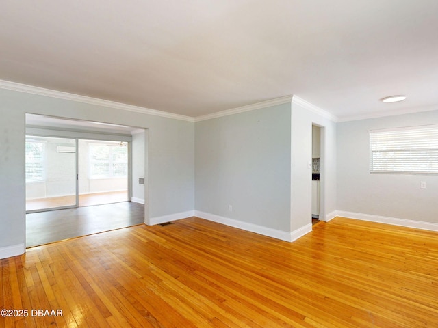 46 Reynolds Ave, Ormond Beach, FL 32174 - empty room featuring light wood finished floors, ornamental molding, and baseboards