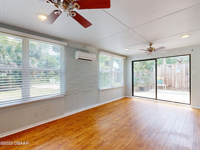 46 Reynolds Ave, Ormond Beach, FL 32174 - unfurnished room with ceiling fan, a wall unit AC, baseboards, and hardwood / wood-style flooring