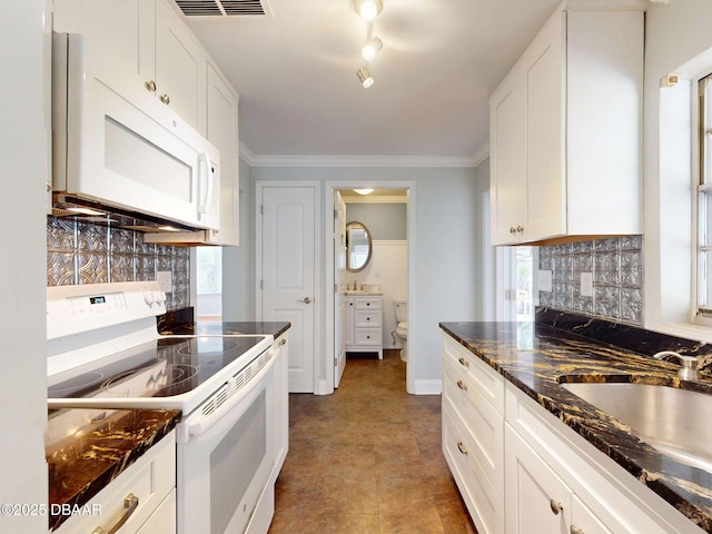 46 Reynolds Ave, Ormond Beach, FL 32174 - kitchen featuring white appliances, tasteful backsplash, white cabinets, healthy amount of natural light, and ornamental molding