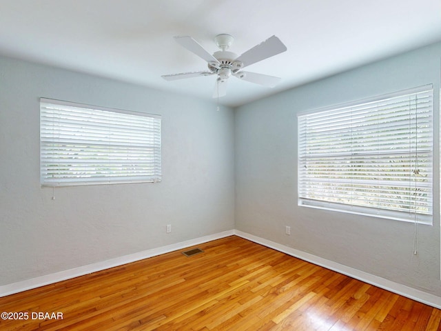 46 Reynolds Ave, Ormond Beach, FL 32174 - empty room featuring baseboards, light wood-type flooring, and a ceiling fan