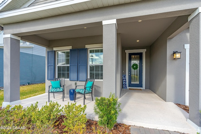 property entrance featuring covered porch