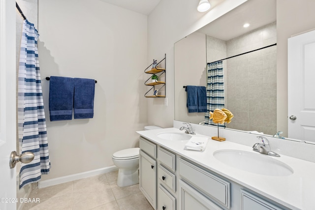 bathroom with tile patterned flooring, vanity, toilet, and a shower with shower curtain