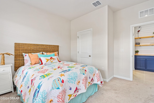 bedroom with light colored carpet