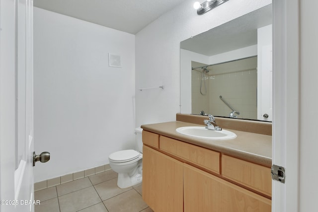bathroom with tile patterned flooring, toilet, vanity, and a shower