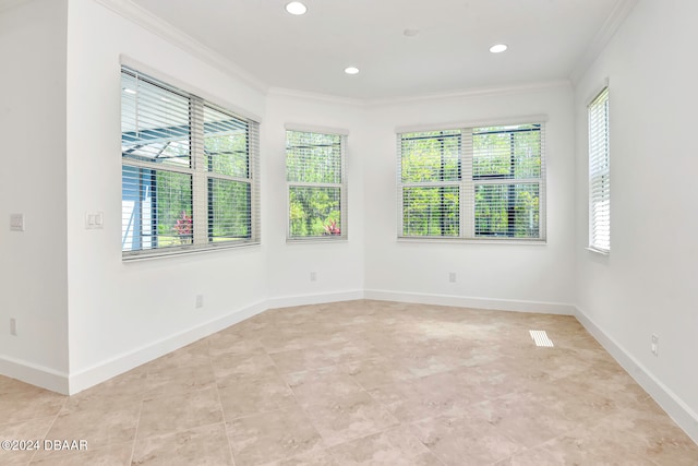 empty room featuring ornamental molding