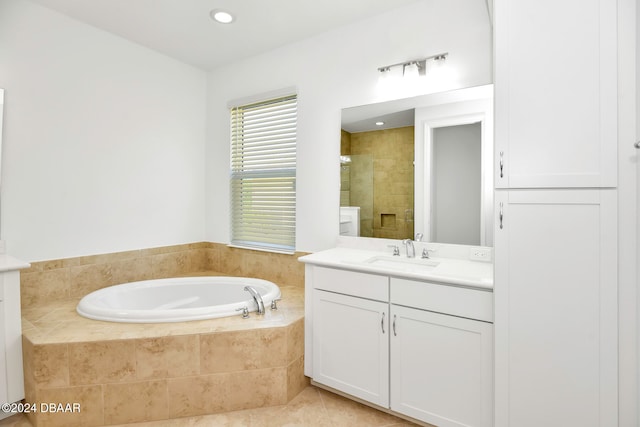 bathroom featuring tile patterned floors, vanity, and plus walk in shower