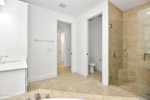 full bathroom with vanity, separate shower and tub, and toilet