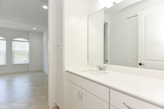 bathroom featuring tile patterned flooring and vanity