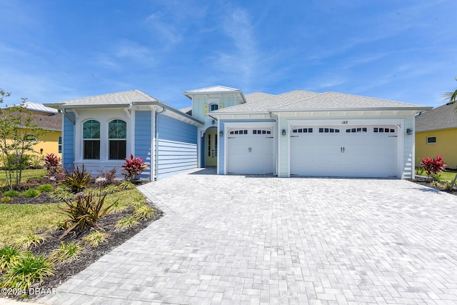 view of front of property with a garage