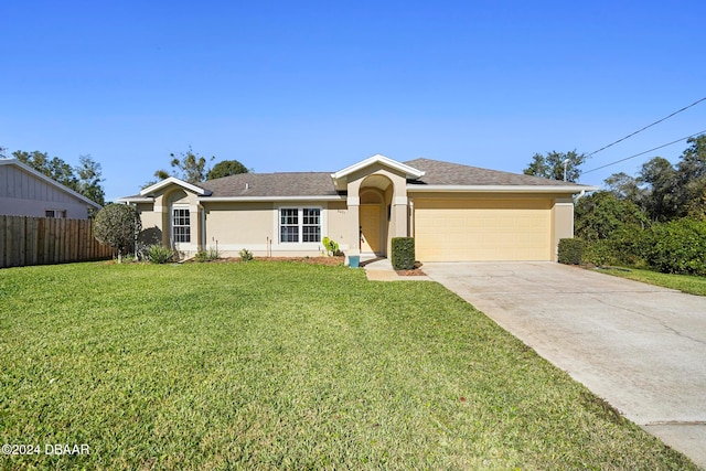 ranch-style home featuring a front yard and a garage