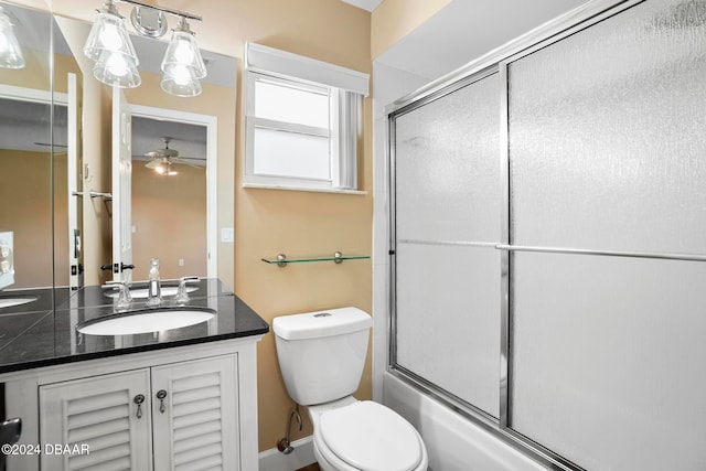 full bathroom featuring ceiling fan, toilet, enclosed tub / shower combo, and vanity