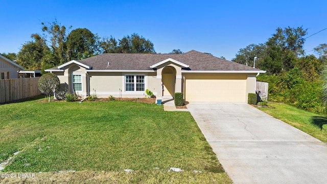 ranch-style home with a garage and a front lawn