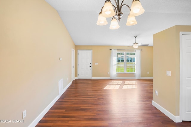 interior space featuring vaulted ceiling, a textured ceiling, ceiling fan with notable chandelier, and dark hardwood / wood-style floors