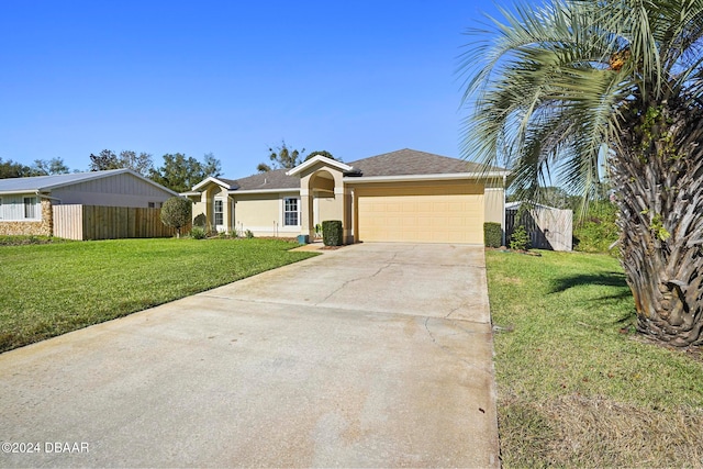 ranch-style house with a garage and a front lawn