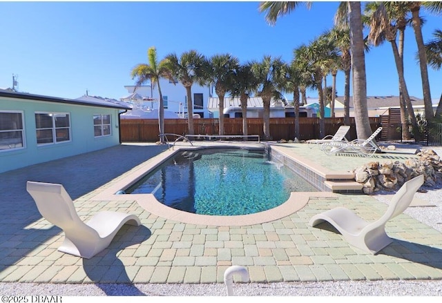 view of swimming pool featuring a patio area