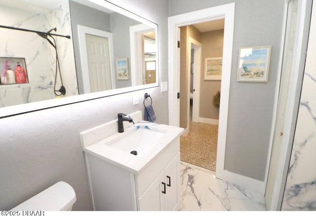 bathroom featuring vanity, a shower, and toilet