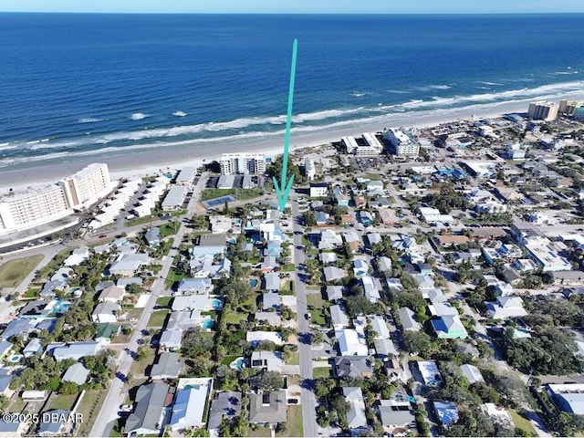 birds eye view of property featuring a view of the beach and a water view