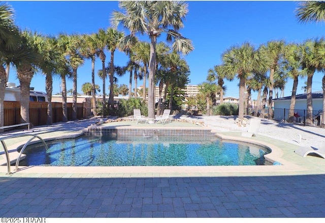 view of swimming pool with a patio