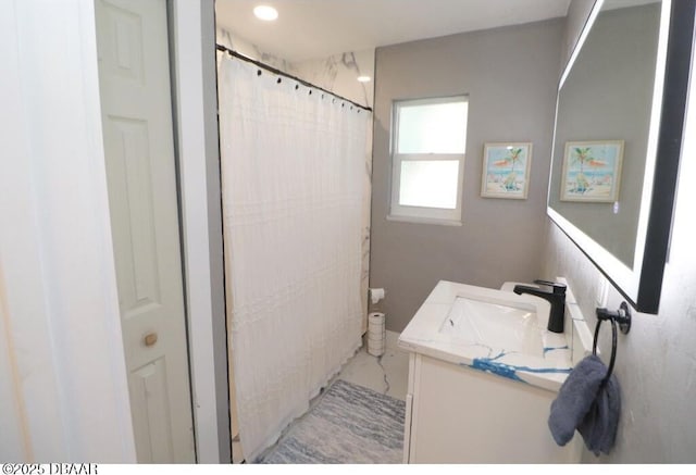 bathroom featuring vanity and a shower with curtain