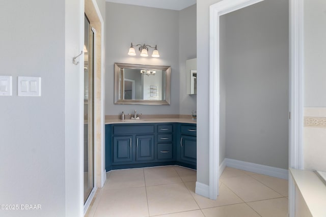 bathroom featuring vanity, tile patterned flooring, and an enclosed shower