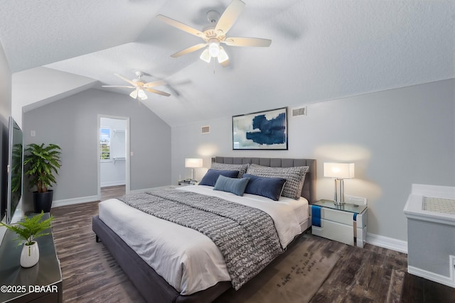 bedroom featuring dark hardwood / wood-style flooring, ceiling fan, vaulted ceiling, and a textured ceiling