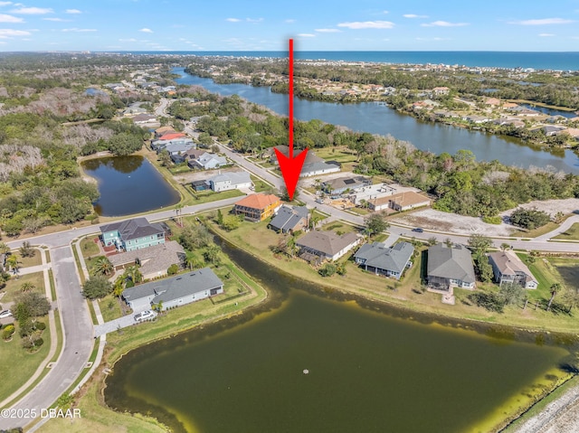 birds eye view of property featuring a water view