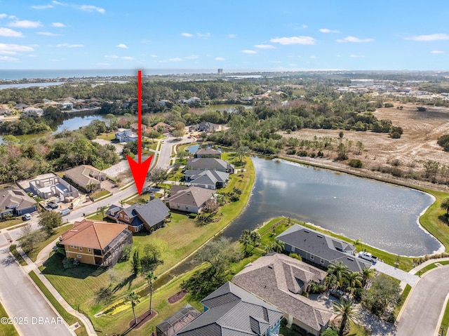 birds eye view of property featuring a water view