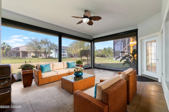 sunroom with ceiling fan