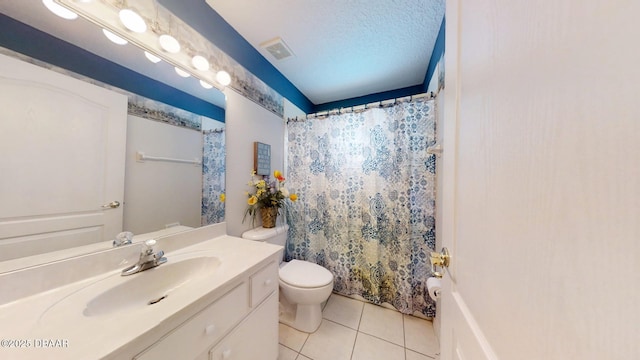 bathroom with visible vents, toilet, tile patterned floors, a textured ceiling, and vanity