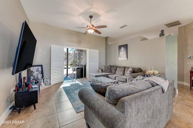 living room featuring ceiling fan and light tile patterned floors