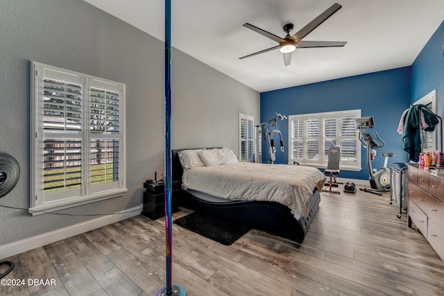 bedroom featuring ceiling fan and light hardwood / wood-style flooring