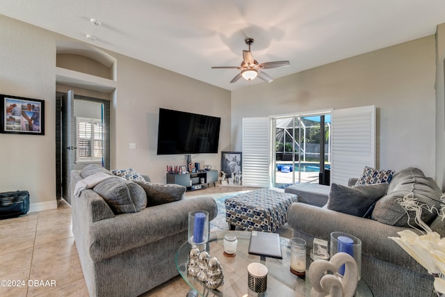 living room featuring ceiling fan and light tile patterned flooring