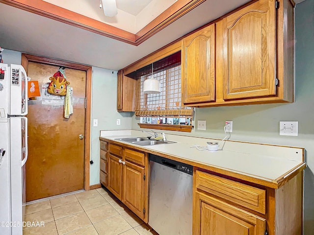 kitchen featuring sink, light tile patterned floors, and dishwasher