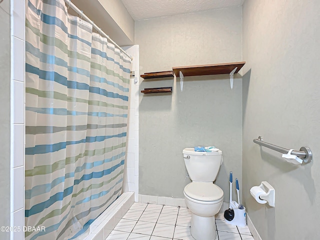 bathroom featuring curtained shower, tile patterned floors, toilet, and a textured ceiling