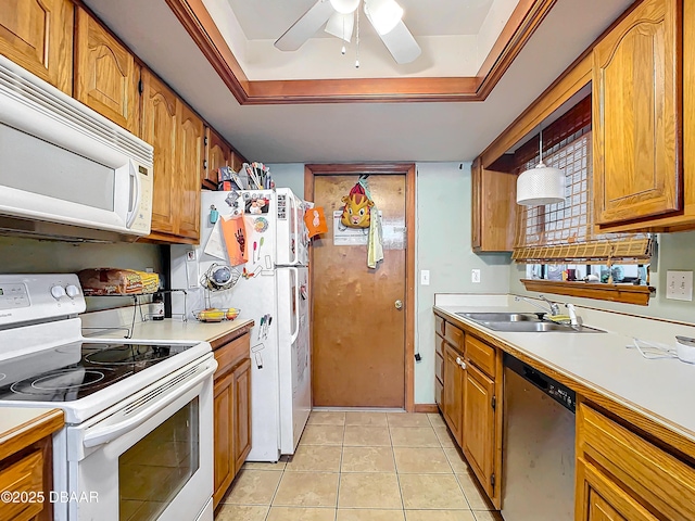 kitchen featuring sink, white appliances, light tile patterned floors, ceiling fan, and hanging light fixtures