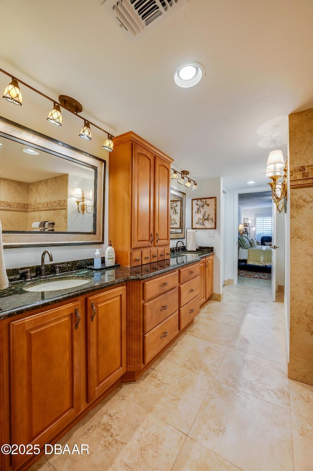 bathroom with vanity and tile patterned flooring