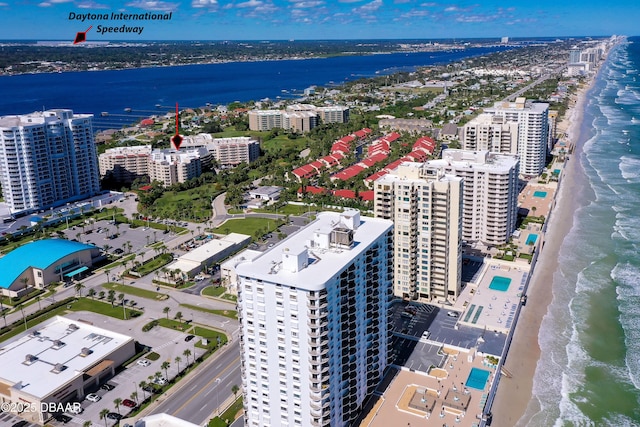 birds eye view of property featuring a water view and a view of the beach