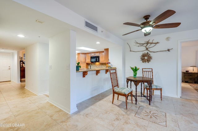 dining area with ceiling fan