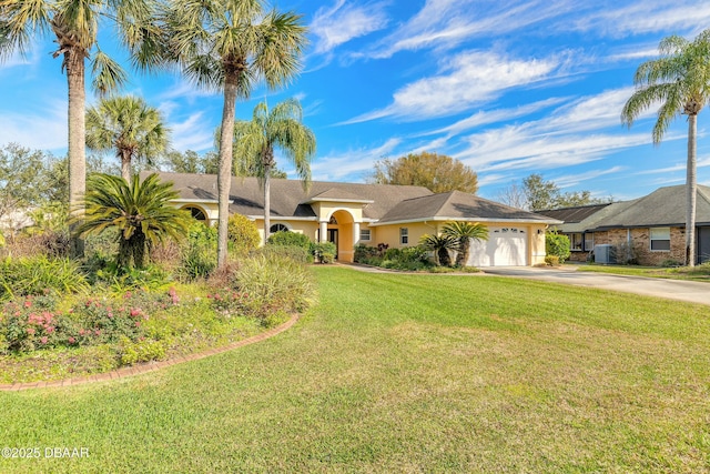 ranch-style house with a garage, cooling unit, and a front lawn