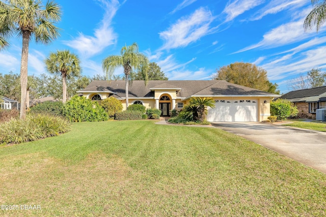 single story home featuring a garage, central AC unit, and a front yard