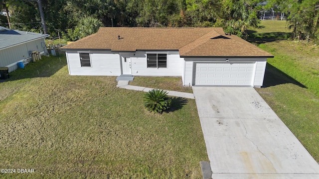 ranch-style house featuring a garage, central air condition unit, and a front yard