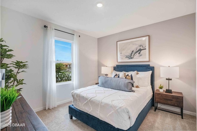 bedroom featuring light colored carpet