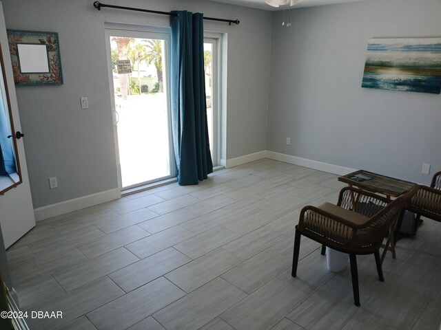 sitting room featuring ceiling fan