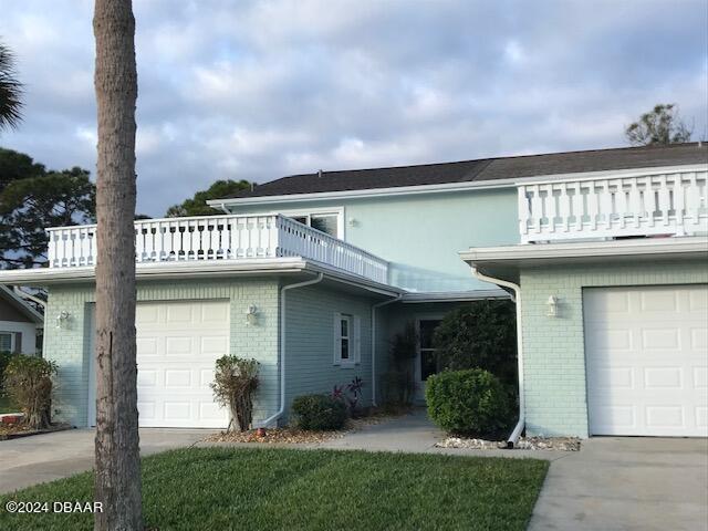 view of front of home with a balcony