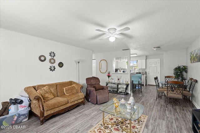 644 Lpga Blvd Unit A, Daytona Beach, FL 32117 - living area featuring a ceiling fan, wood finished floors, and a textured ceiling