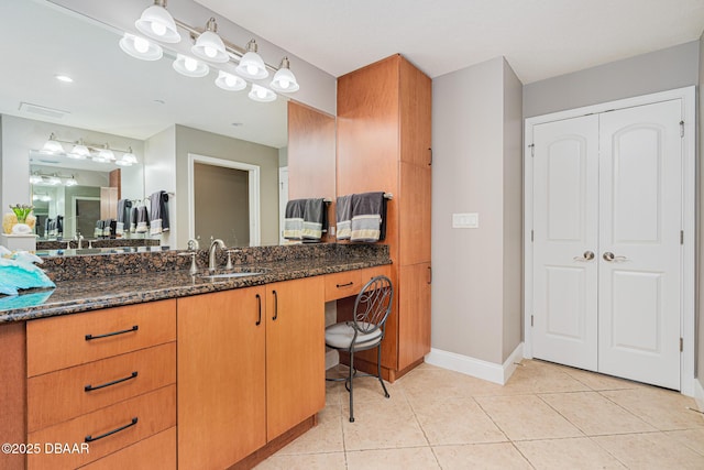 bathroom with tile patterned flooring and vanity