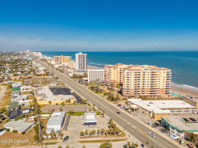 bird's eye view with a water view and a view of the beach